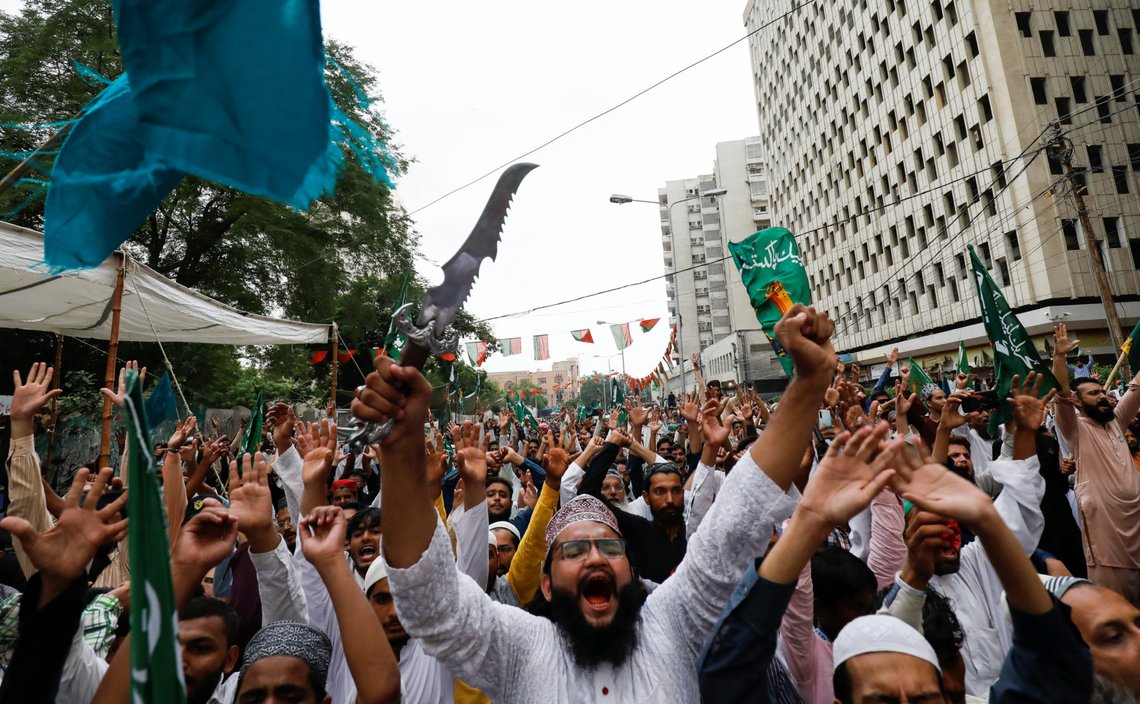 A supporter of religious and political party Tehreek-e-Labaik Pakistan (TLP) waves a dagger, as he chants slogans with others against the satirical French weekly newspaper Charlie Hebdo, which reprinted a cartoon of the Prophet Mohammad, during a protest in Karachi, Pakistan September 4, 2020. REUTERS/Akhtar Soomro A supporter of religious and political party Tehreek-e-Labaik Pakistan (TLP) waves a dagger, as he chants slogans with others against the satirical French weekly newspaper Charlie Hebdo, which reprinted a cartoon of the Prophet Mohammad, during a protest in Karachi, Pakistan September 4, 2020. REUTERS/Akhtar Soomro