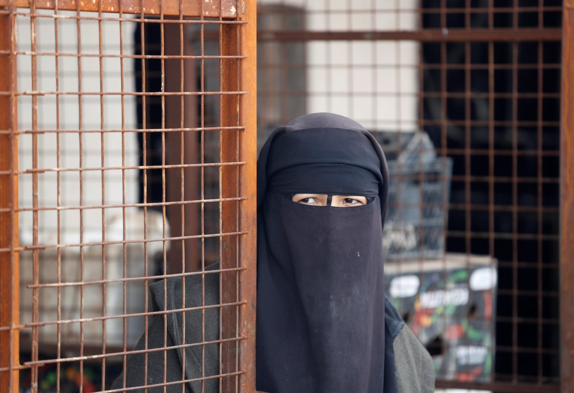 A woman looks out at al-Hol camp, Syria, January 8, 2020. REUTERS/Goran Tomasevic SEARCH "ISLAMIC STATE PRISONERS" FOR THIS STORY. SEARCH "WIDER IMAGE" FOR ALL STORIES. A woman looks out at al-Hol camp, Syria, January 8, 2020. REUTERS/Goran Tomasevic SEARCH "ISLAMIC STATE PRISONERS" FOR THIS STORY. SEARCH "WIDER IMAGE" FOR ALL STORIES.