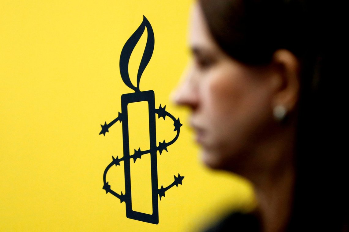 FILE PHOTO: The logo of Amnesty International is seen next to director of Mujeres En Linea Luisa Kislinger, during a news conference in Caracas, Venezuela February 20, 2019. REUTERS/Carlos Jass/File Photo FILE PHOTO: The logo of Amnesty International is seen next to director of Mujeres En Linea Luisa Kislinger, during a news conference in Caracas, Venezuela February 20, 2019. REUTERS/Carlos Jass/File Photo
