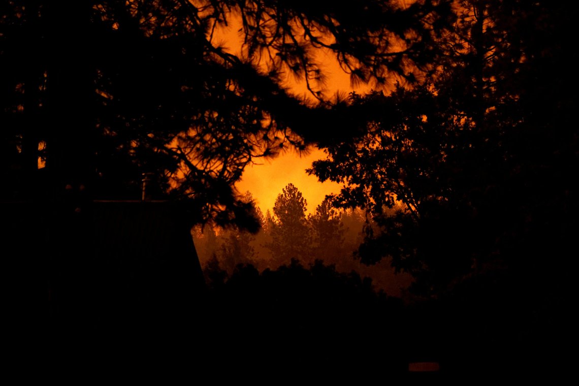 The Sierra National Forest is illuminated by a burning fire during the Creek Fire in Tollhouse, California, U.S. September 8, 2020. REUTERS/Stephen Lam The Sierra National Forest is illuminated by a burning fire during the Creek Fire in Tollhouse, California, U.S. September 8, 2020. REUTERS/Stephen Lam