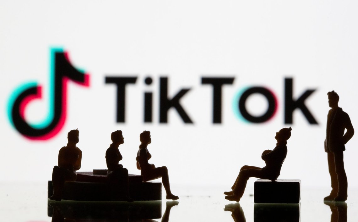 Small toy figures are seen in front of a Tiktok logo in this illustration taken, September 9, 2020. REUTERS/Dado Ruvic/Illustration Small toy figures are seen in front of a Tiktok logo in this illustration taken, September 9, 2020. REUTERS/Dado Ruvic/Illustration