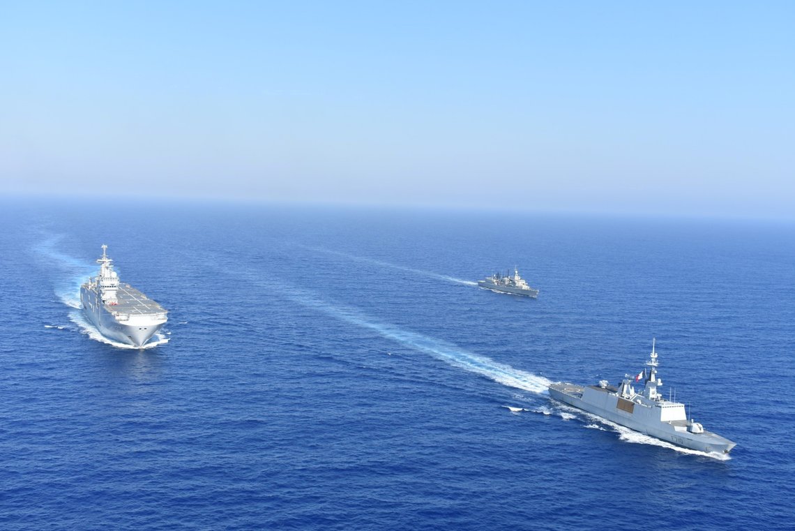 FILE PHOTO: Greek and French vessels sail in formation during a joint military exercise in Mediterranean sea, in this undated handout image obtained by Reuters on August 13, 2020. Greek Ministry of Defence/Handout via REUTERS ATTENTION EDITORS - THIS PICTURE WAS PROVIDED BY A THIRD PARTY/File Photo FILE PHOTO: Greek and French vessels sail in formation during a joint military exercise in Mediterranean sea, in this undated handout image obtained by Reuters on August 13, 2020. Greek Ministry of Defence/Handout via REUTERS ATTENTION EDITORS - THIS PICTURE WAS PROVIDED BY A THIRD PARTY/File Photo