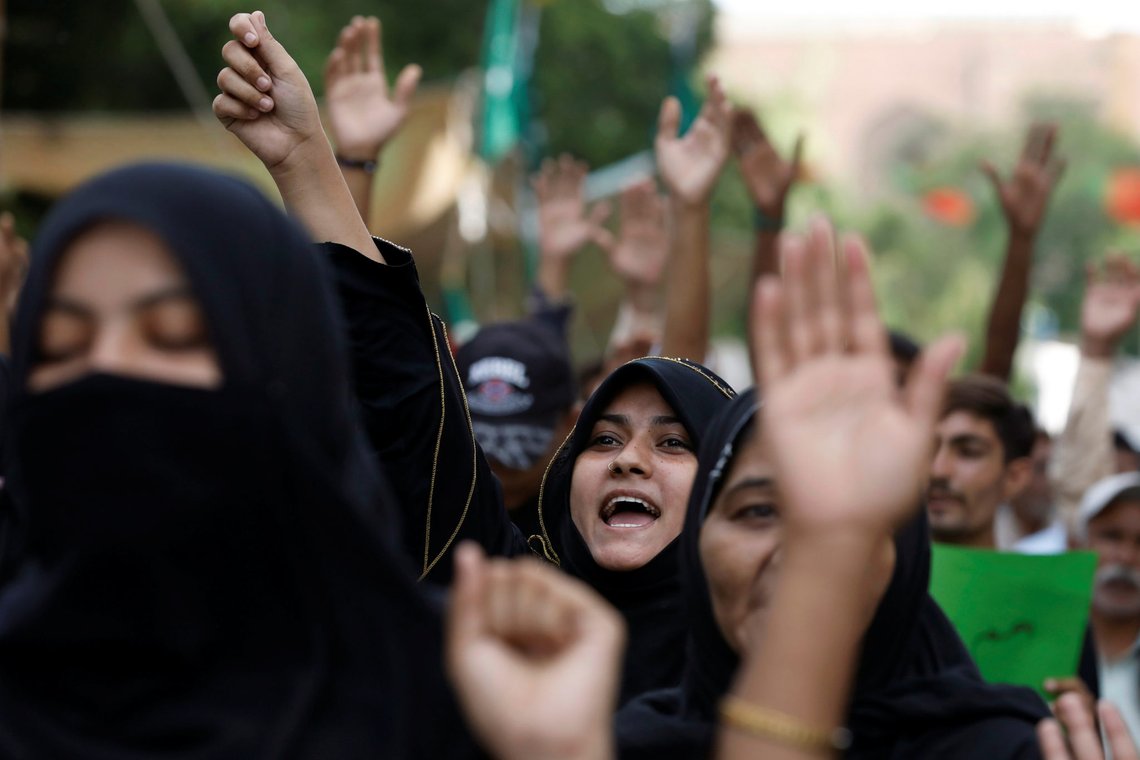 People raise their hands as they chant slogans against the satirical French weekly newspaper Charlie Hebdo, which reprinted a cartoon of the Prophet Mohammad, and condemn the burning of the holy Koran in Sweden, during a protest in Karachi, Pakistan September 6, 2020. REUTERS/Akhtar Soomro People raise their hands as they chant slogans against the satirical French weekly newspaper Charlie Hebdo, which reprinted a cartoon of the Prophet Mohammad, and condemn the burning of the holy Koran in Sweden, during a protest in Karachi, Pakistan September 6, 2020. REUTERS/Akhtar Soomro