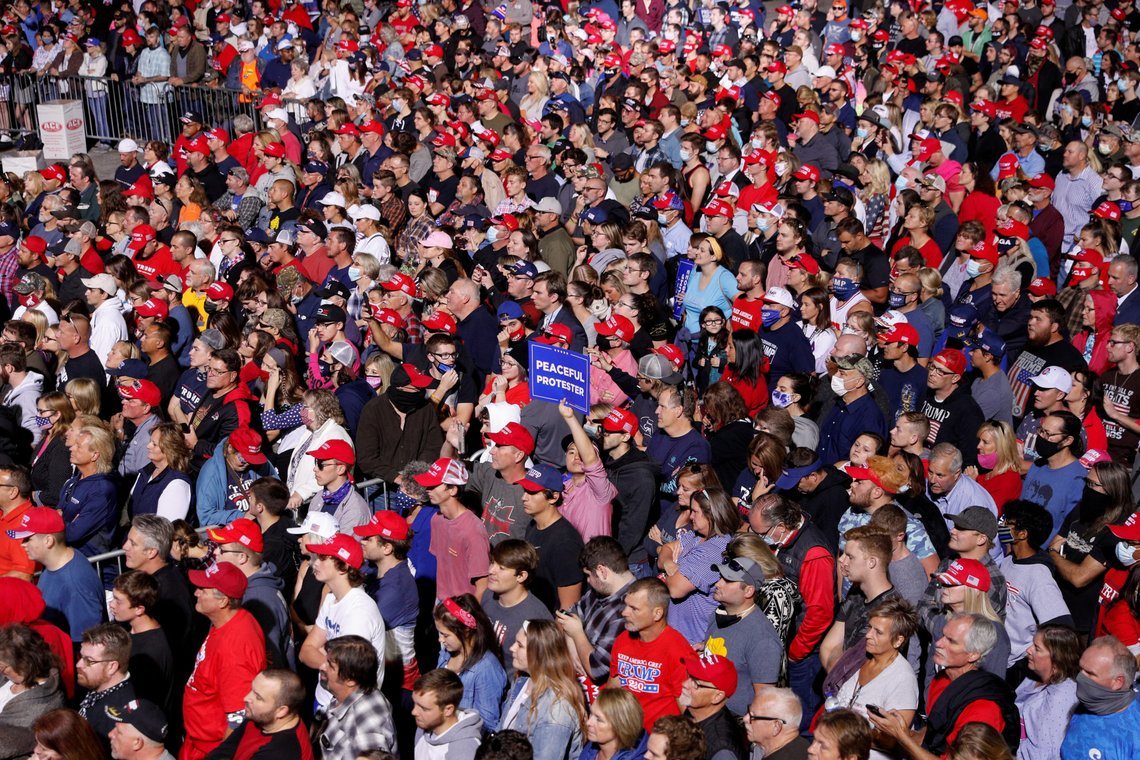 Audience members listen as U.S. President Donald Trump delivers a speech during a campaign rally at Toledo Express Airport in Swanton, Ohio, U.S., September 21, 2020. REUTERS/Tom Brenner TPX IMAGES OF THE DAY Audience members listen as U.S. President Donald Trump delivers a speech during a campaign rally at Toledo Express Airport in Swanton, Ohio, U.S., September 21, 2020. REUTERS/Tom Brenner TPX IMAGES OF THE DAY
