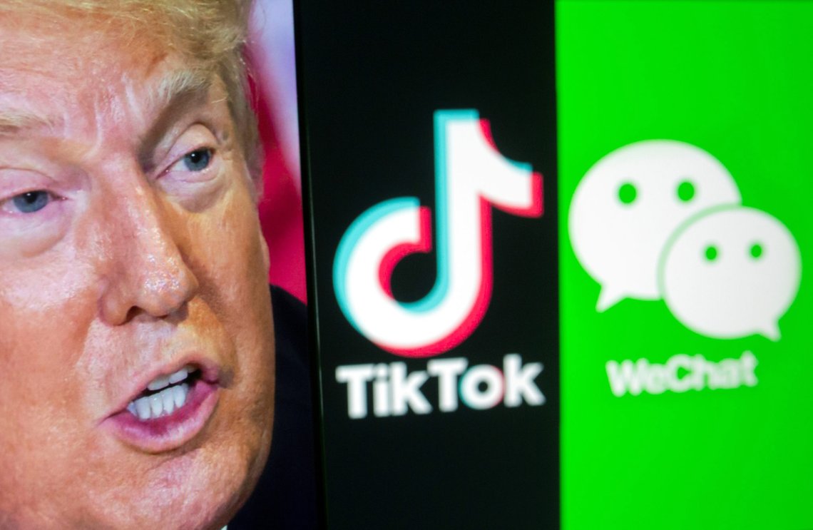 A picture of U.S. President Donald Trump is seen on a smartphone in front of displayed Tik Tok and WeChat logos in this illustration taken September 18, 2020. REUTERS/Dado Ruvic/Illustration A picture of U.S. President Donald Trump is seen on a smartphone in front of displayed Tik Tok and WeChat logos in this illustration taken September 18, 2020. REUTERS/Dado Ruvic/Illustration