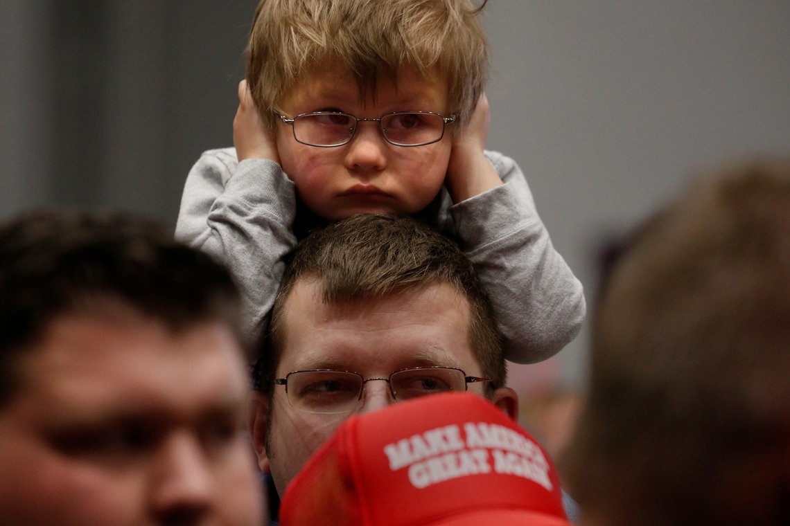 A child covers his ears before Republican presidential nominee Donald Trump appears at a campaign rally in Sioux City, Iowa, U.S. November 6, 2016. REUTERS/Carlo Allegri A child covers his ears before Republican presidential nominee Donald Trump appears at a campaign rally in Sioux City, Iowa, U.S. November 6, 2016. REUTERS/Carlo Allegri