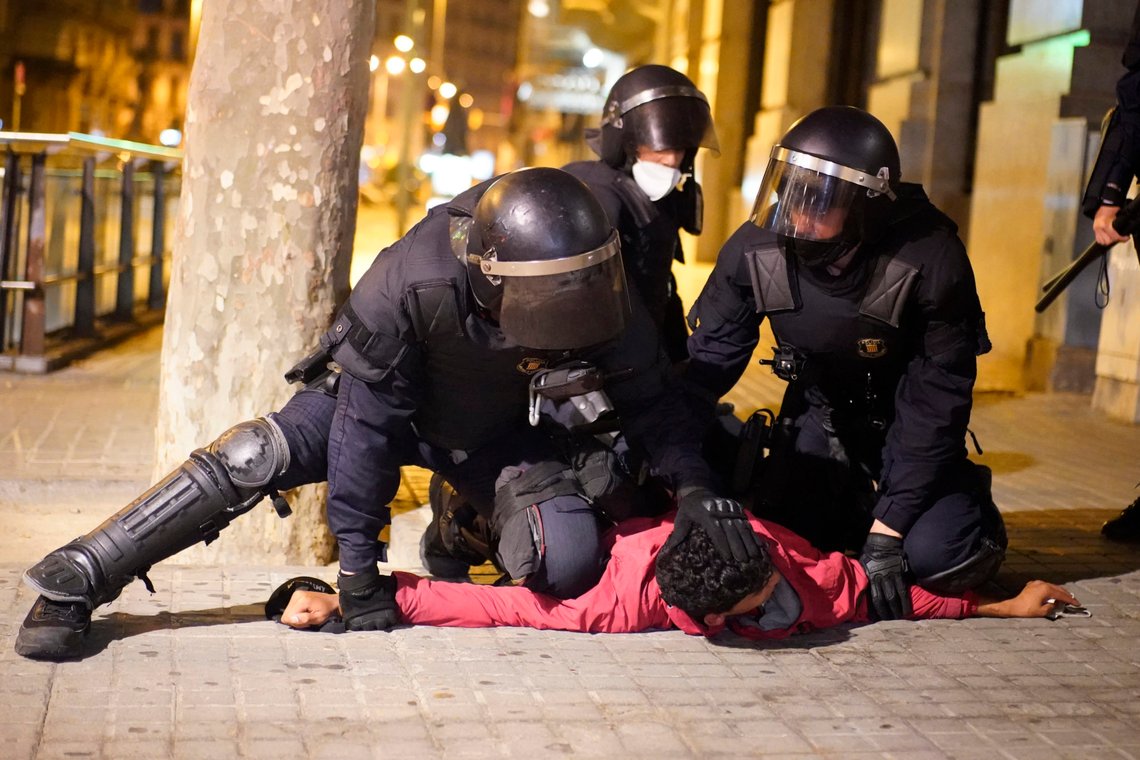 A demonstrator is detained by police officers during clashes in downtown Barcelona, Spain, Friday, Oct. 30, 2020. Clashes have erupted in a central Barcelona square between anti-riot police and hundreds who had gathered to protest the mandatory closure of bars, restaurants and other businesses in the latest effort to rein in on coronavirus outbreaks. (AP Photo/Joan Mateu) A demonstrator is detained by police officers during clashes in downtown Barcelona, Spain, Friday, Oct. 30, 2020. Clashes have erupted in a central Barcelona square between anti-riot police and hundreds who had gathered to protest the mandatory closure of bars, restaurants and other businesses in the latest effort to rein in on coronavirus outbreaks. (AP Photo/Joan Mateu)