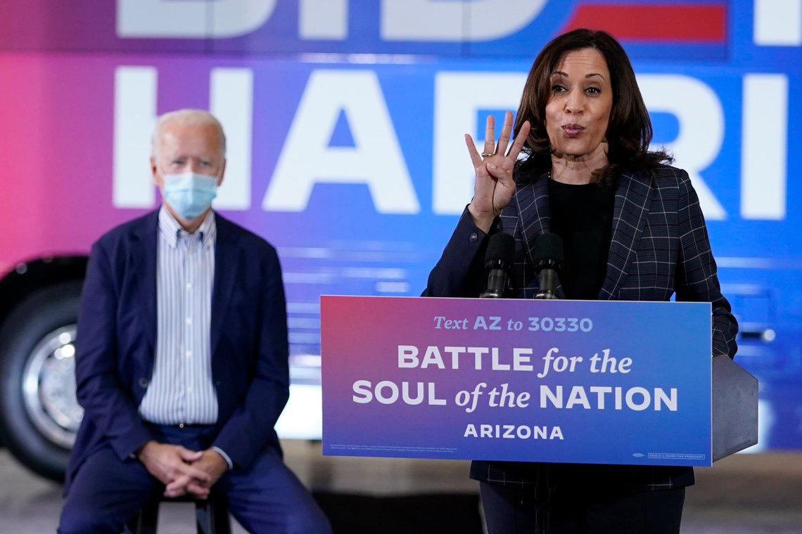 Democratic presidential candidate former Vice President Joe Biden listens as Democratic vice presidential candidate Sen. Kamala Harris, D-Calif., speaks at Carpenters Local Union 1912 in Phoenix, Thursday, Oct. 8, 2020, to kick off a small business bus tour. (AP Photo/Carolyn Kaster) Democratic presidential candidate former Vice President Joe Biden listens as Democratic vice presidential candidate Sen. Kamala Harris, D-Calif., speaks at Carpenters Local Union 1912 in Phoenix, Thursday, Oct. 8, 2020, to kick off a small business bus tour. (AP Photo/Carolyn Kaster)
