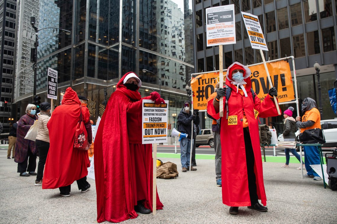 Protesters hold signs during the Women's March at Daley Plaza in the Loop Saturday Oct. 17, 2020 in Chicago. Dozens of Women's March rallies were planned from New York to San Francisco to signal opposition to President Donald Trump and his policies, including the push to fill the seat of late Supreme Court Justice Ruth Bader Ginsburg before Election Day. (Pat Nabong /Chicago Sun-Times via AP) Protesters hold signs during the Women's March at Daley Plaza in the Loop Saturday Oct. 17, 2020 in Chicago. Dozens of Women's March rallies were planned from New York to San Francisco to signal opposition to President Donald Trump and his policies, including the push to fill the seat of late Supreme Court Justice Ruth Bader Ginsburg before Election Day. (Pat Nabong /Chicago Sun-Times via AP)