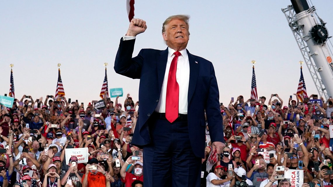 President Donald Trump arrives for a campaign rally at Orlando Sanford International Airport, Monday, Oct. 12, 2020, in Sanford, Fla. (AP Photo/Evan Vucci) President Donald Trump arrives for a campaign rally at Orlando Sanford International Airport, Monday, Oct. 12, 2020, in Sanford, Fla. (AP Photo/Evan Vucci)