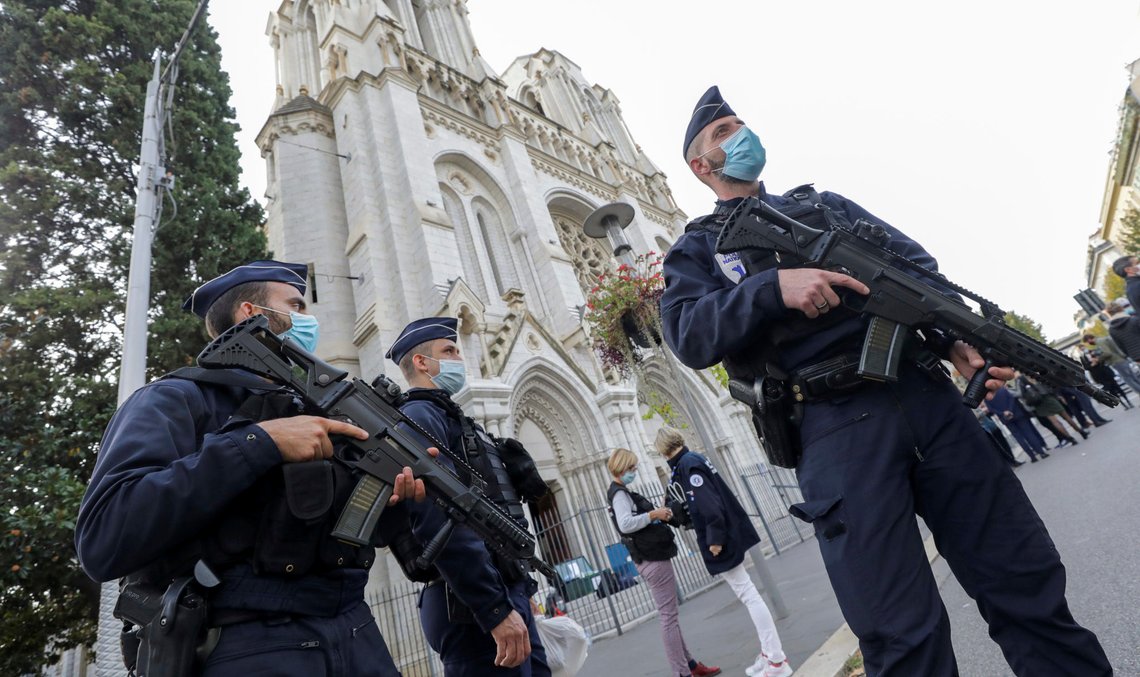 French police officers stand near Notre Dame church in Nice, southern France, Thursday, Oct. 29, 2020. French President Emmanuel Macron has announced that he will more than double number of soldiers deployed to protect against attacks to 7,000 after three people were killed at a church Thursday. (Eric Gaillard/Pool via AP) French police officers stand near Notre Dame church in Nice, southern France, Thursday, Oct. 29, 2020. French President Emmanuel Macron has announced that he will more than double number of soldiers deployed to protect against attacks to 7,000 after three people were killed at a church Thursday. (Eric Gaillard/Pool via AP)