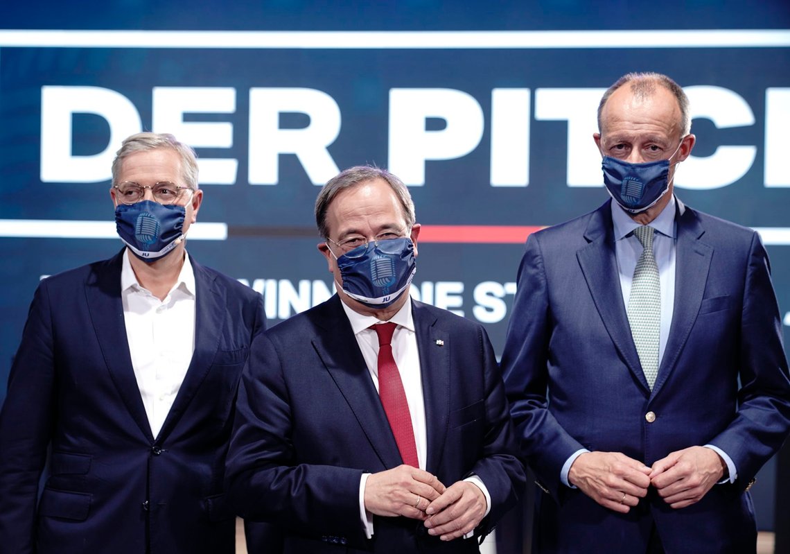 The three candidates for the chairmanship of the Christian Democratic Union party, CDU, Norbert Roettgen, left, Armin Laschet, center, and Friedrich Merz, right, attends an event of the party's youth organisation, Junge Union (JU) in Berlin, Saturday, Oct. 17, 2020. German Chancellor Angela Merkel's party CDU on again delayed a decision on who will become its new leader, putting off a convention planned for December in a move that irked one of the leading contenders. Whoever wins the Christian Democratic Union's leadership will be in pole position to become the center-right candidate to succeed Merkel as chancellor in next year's German election, though that isn't guaranteed. (Michael Kappeler/dpa via AP) The three candidates for the chairmanship of the Christian Democratic Union party, CDU, Norbert Roettgen, left, Armin Laschet, center, and Friedrich Merz, right, attends an event of the party's youth organisation, Junge Union (JU) in Berlin, Saturday, Oct. 17, 2020. German Chancellor Angela Merkel's party CDU on again delayed a decision on who will become its new leader, putting off a convention planned for December in a move that irked one of the leading contenders. Whoever wins the Christian Democratic Union's leadership will be in pole position to become the center-right candidate to succeed Merkel as chancellor in next year's German election, though that isn't guaranteed. (Michael Kappeler/dpa via AP)
