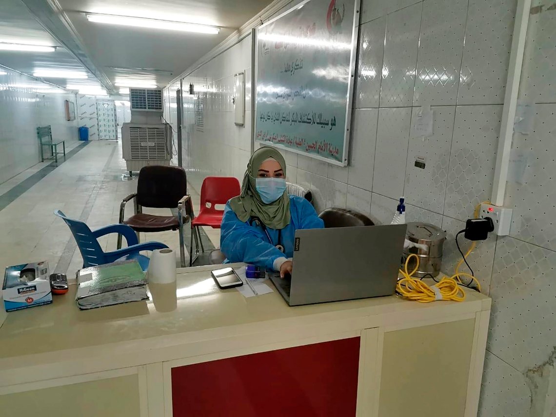 This May 13, 2020, picture provided by Dr. Marwa al-Khafaji shows the doctor back at work following 20 days in isolation after she tested positive for the coronavirus at a hospital in Karbala, Iraq. Dr. Marwa al-Khafajis homecoming from a hospital isolation ward was tainted by spite. Someone had barricaded her family homes gate with a concrete block. The message from the neighbors was clear: She had survived coronavirus, but the stigma of having had the disease would be a more pernicious fight. (AP Photo) This May 13, 2020, picture provided by Dr. Marwa al-Khafaji shows the doctor back at work following 20 days in isolation after she tested positive for the coronavirus at a hospital in Karbala, Iraq. Dr. Marwa al-Khafajis homecoming from a hospital isolation ward was tainted by spite. Someone had barricaded her family homes gate with a concrete block. The message from the neighbors was clear: She had survived coronavirus, but the stigma of having had the disease would be a more pernicious fight. (AP Photo)
