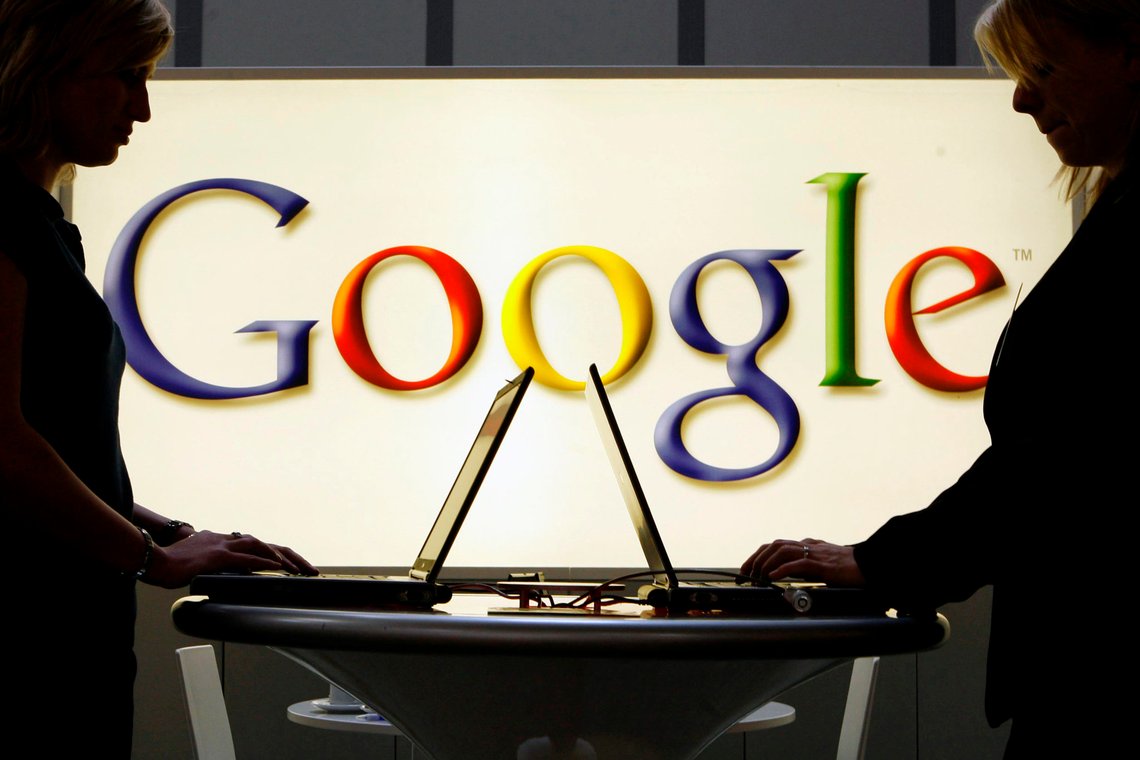 FILE - In this April 17, 2007 file photo, exhibitors work on laptop computers in front of an illuminated sign of the Google logo at the industrial fair Hannover Messe in Hanover, Germany. The Justice Departments lawsuit against Google alleging antitrust violations marks the governments most significant attempt to protect competition since its groundbreaking case against Microsoft more than 20 years ago. (AP Photo/Jens Meyer, File) FILE - In this April 17, 2007 file photo, exhibitors work on laptop computers in front of an illuminated sign of the Google logo at the industrial fair Hannover Messe in Hanover, Germany. The Justice Departments lawsuit against Google alleging antitrust violations marks the governments most significant attempt to protect competition since its groundbreaking case against Microsoft more than 20 years ago. (AP Photo/Jens Meyer, File)