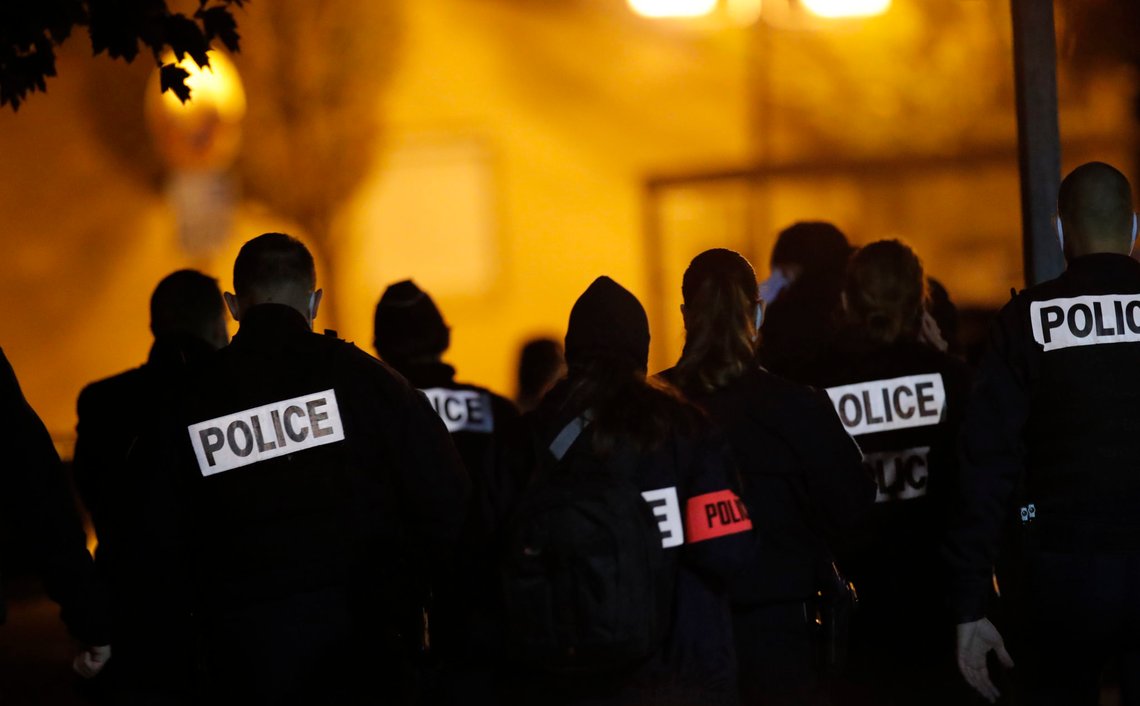 French police officers gather outside a high school after a history teacher who opened a discussion with students on caricatures of Islam's Prophet Muhammad was beheaded, Friday, Oct. 16, 2020 in Conflans-Saint-Honorine, north of Paris. Police have shot the suspected killer dead. (AP Photo/Michel Euler) French police officers gather outside a high school after a history teacher who opened a discussion with students on caricatures of Islam's Prophet Muhammad was beheaded, Friday, Oct. 16, 2020 in Conflans-Saint-Honorine, north of Paris. Police have shot the suspected killer dead. (AP Photo/Michel Euler)