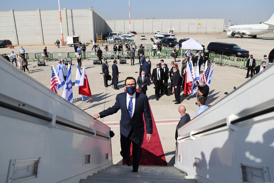 U.S. Treasury Secretary Steve Mnuchin boards an Israeli flag carrier El Al plane as he accompanies an Israeli delegation to Bahrain, at Ben Gurion airport in Lod, near Tel Aviv, Israel Sunday, Oct. 18, 2020. (Ronen Zvulun/Pool Photo via AP) U.S. Treasury Secretary Steve Mnuchin boards an Israeli flag carrier El Al plane as he accompanies an Israeli delegation to Bahrain, at Ben Gurion airport in Lod, near Tel Aviv, Israel Sunday, Oct. 18, 2020. (Ronen Zvulun/Pool Photo via AP)