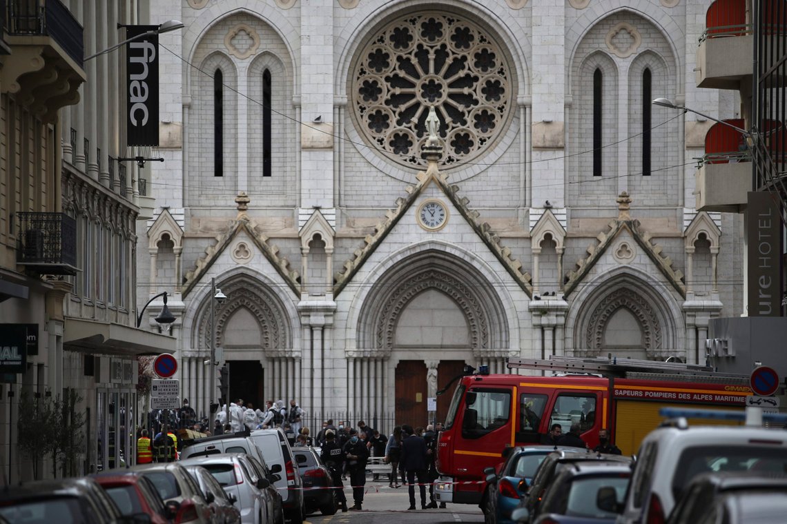 French policemen and forensic officers stand in front of Notre Dame church after a knife attack, in Nice, France, Thursday, Oct. 29, 2020. French anti-terrorism prosecutors are investigating a knife attack at a church in the Mediterranean city of Nice that killed two people and injured several others. (AP Photo/Daniel Cole) French policemen and forensic officers stand in front of Notre Dame church after a knife attack, in Nice, France, Thursday, Oct. 29, 2020. French anti-terrorism prosecutors are investigating a knife attack at a church in the Mediterranean city of Nice that killed two people and injured several others. (AP Photo/Daniel Cole)