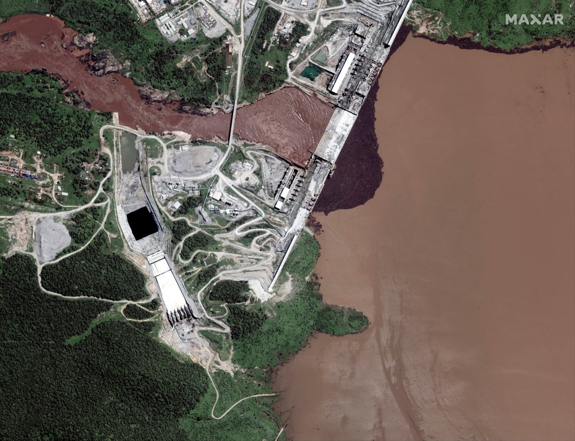 This satellite image taken Sunday, July 12, 2020, shows the Grand Ethiopian Renaissance Dam on the Blue Nile river in the Benishangul-Gumuz region of Ethiopia. New satellite imagery shows the reservoir behind Ethiopia's disputed hydroelectric dam beginning to fill, but an analyst says it's likely due to seasonal rains instead of government action. (Maxar Technologies via AP) This satellite image taken Sunday, July 12, 2020, shows the Grand Ethiopian Renaissance Dam on the Blue Nile river in the Benishangul-Gumuz region of Ethiopia. New satellite imagery shows the reservoir behind Ethiopia's disputed hydroelectric dam beginning to fill, but an analyst says it's likely due to seasonal rains instead of government action. (Maxar Technologies via AP)