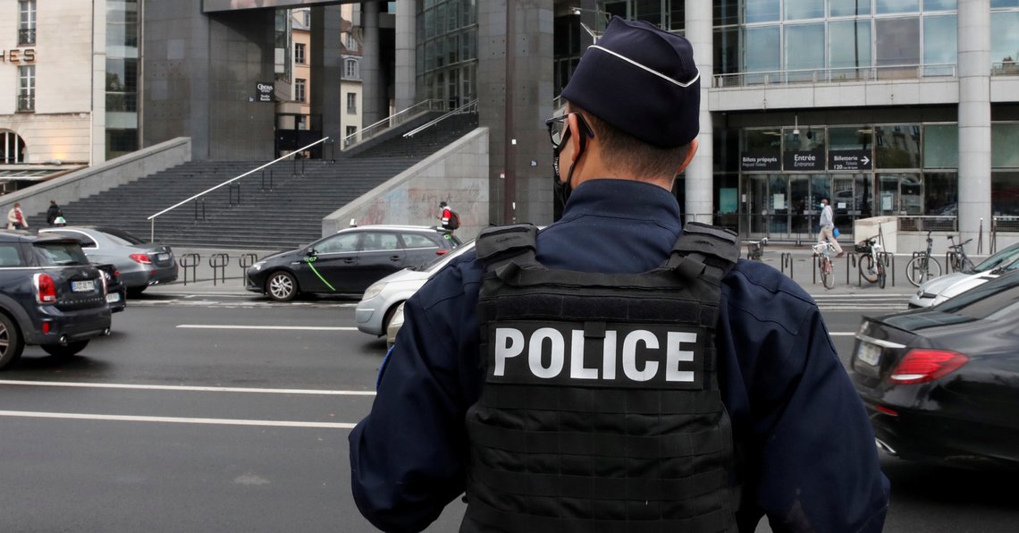 FILE PHOTO: A French police officer stands near the Opera Bastille where a suspect in a stabbing attack near the former offices of the magazine Charlie Hebdo was arrested in Paris, France September 25, 2020. REUTERS/Gonzalo Fuentes/File Photo FILE PHOTO: A French police officer stands near the Opera Bastille where a suspect in a stabbing attack near the former offices of the magazine Charlie Hebdo was arrested in Paris, France September 25, 2020. REUTERS/Gonzalo Fuentes/File Photo