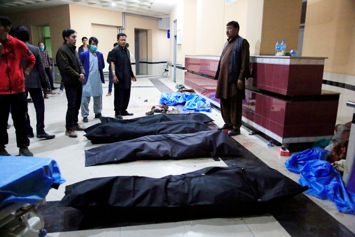 Afghan men look for their relatives at a hospital after a suicide attack in Kabul, Afghanistan, Saturday, Oct. 24, 2020. The death toll from the suicide attack Saturday in Afghanistan's capital has risen that includes schoolchildren, the interior ministry said.. (AP Photo/Mariam Zuhaib) Afghan men look for their relatives at a hospital after a suicide attack in Kabul, Afghanistan, Saturday, Oct. 24, 2020. The death toll from the suicide attack Saturday in Afghanistan's capital has risen that includes schoolchildren, the interior ministry said.. (AP Photo/Mariam Zuhaib)
