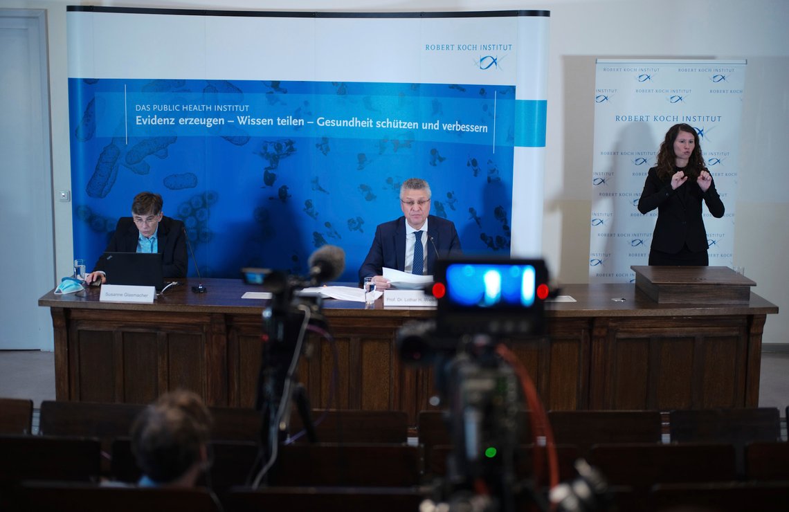 The head of the Robert Koch Institute, Germany's federal government agency and research institute responsible for disease control and prevention, Lothar Wieler, center, addresses a news conference on the coronavirus and the COVID-19 disease in Berlin, Thursday, Oct. 22, 2020. Germany's disease control center is reporting a new daily record increase in coronavirus infections, which rocketed past the 10,000 mark for the first time as the pandemic continues to spread. Slogan in background reads: 'Generating evidence sharing knowledge protecting and improving health'. (AP Photo/Markus Schreiber, Pool) The head of the Robert Koch Institute, Germany's federal government agency and research institute responsible for disease control and prevention, Lothar Wieler, center, addresses a news conference on the coronavirus and the COVID-19 disease in Berlin, Thursday, Oct. 22, 2020. Germany's disease control center is reporting a new daily record increase in coronavirus infections, which rocketed past the 10,000 mark for the first time as the pandemic continues to spread. Slogan in background reads: 'Generating evidence sharing knowledge protecting and improving health'. (AP Photo/Markus Schreiber, Pool)