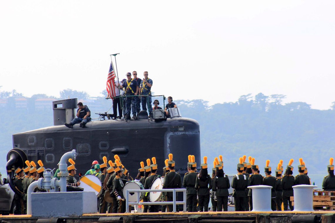 A local marching band welcomes the arrival of sailors aboard the USS Topeka (SSN-754), a Los Angeles-class submarine, as it prepares to be docked at the Alava pier off Subic port in Zambales province for a three-day port call at northwestern Philippines, Tuesday, Jan. 12, 2016. The Philippines' Supreme Court declared as constitutional on Tuesday the 10-year defense pact, Enhanced Defense Cooperation Agreement, that allows American forces, warships and planes to temporarily base in local military camps in a boost to U.S. efforts to reassert its presence in Asia, where China has loomed large. (AP Photo/Jun Dumaguing) A local marching band welcomes the arrival of sailors aboard the USS Topeka (SSN-754), a Los Angeles-class submarine, as it prepares to be docked at the Alava pier off Subic port in Zambales province for a three-day port call at northwestern Philippines, Tuesday, Jan. 12, 2016. The Philippines' Supreme Court declared as constitutional on Tuesday the 10-year defense pact, Enhanced Defense Cooperation Agreement, that allows American forces, warships and planes to temporarily base in local military camps in a boost to U.S. efforts to reassert its presence in Asia, where China has loomed large. (AP Photo/Jun Dumaguing)