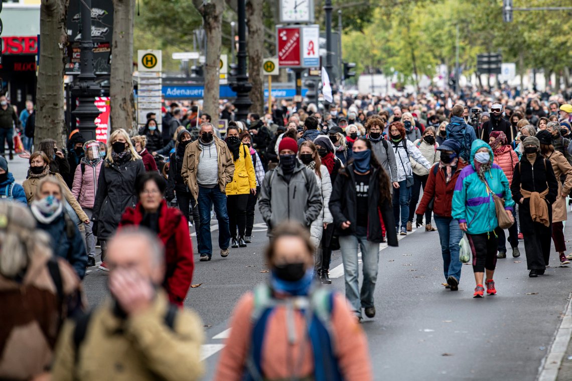 Participants of the demonstration "We have to talk" walk through the Berlin, Germany, Saturday, Oct. 10, 2020. The organizers of the demonstration are calling for a silent march to demonstrate against the corona virus measures in Germany. (Fabian Sommer/dpa via AP) Participants of the demonstration "We have to talk" walk through the Berlin, Germany, Saturday, Oct. 10, 2020. The organizers of the demonstration are calling for a silent march to demonstrate against the corona virus measures in Germany. (Fabian Sommer/dpa via AP)