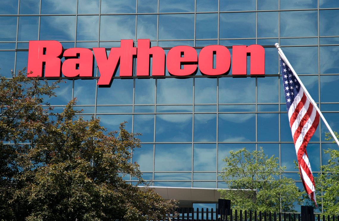 FILE - In this June 10, 2019, file photo, an American flag flies in front of the facade of Raytheon's Integrated Defense Systems facility, in Woburn, Mass. China's government said Monday, Oct. 26, 2020, it will impose sanctions on U.S. military contractors including Boeing Co.'s defense unit and Lockheed Martin Corp. for supplying weapons to rival Taiwan, stepping up a feud with Washington over security and Beijing's strategic ambitions. (AP Photo/Elise Amendola, File) FILE - In this June 10, 2019, file photo, an American flag flies in front of the facade of Raytheon's Integrated Defense Systems facility, in Woburn, Mass. China's government said Monday, Oct. 26, 2020, it will impose sanctions on U.S. military contractors including Boeing Co.'s defense unit and Lockheed Martin Corp. for supplying weapons to rival Taiwan, stepping up a feud with Washington over security and Beijing's strategic ambitions. (AP Photo/Elise Amendola, File)