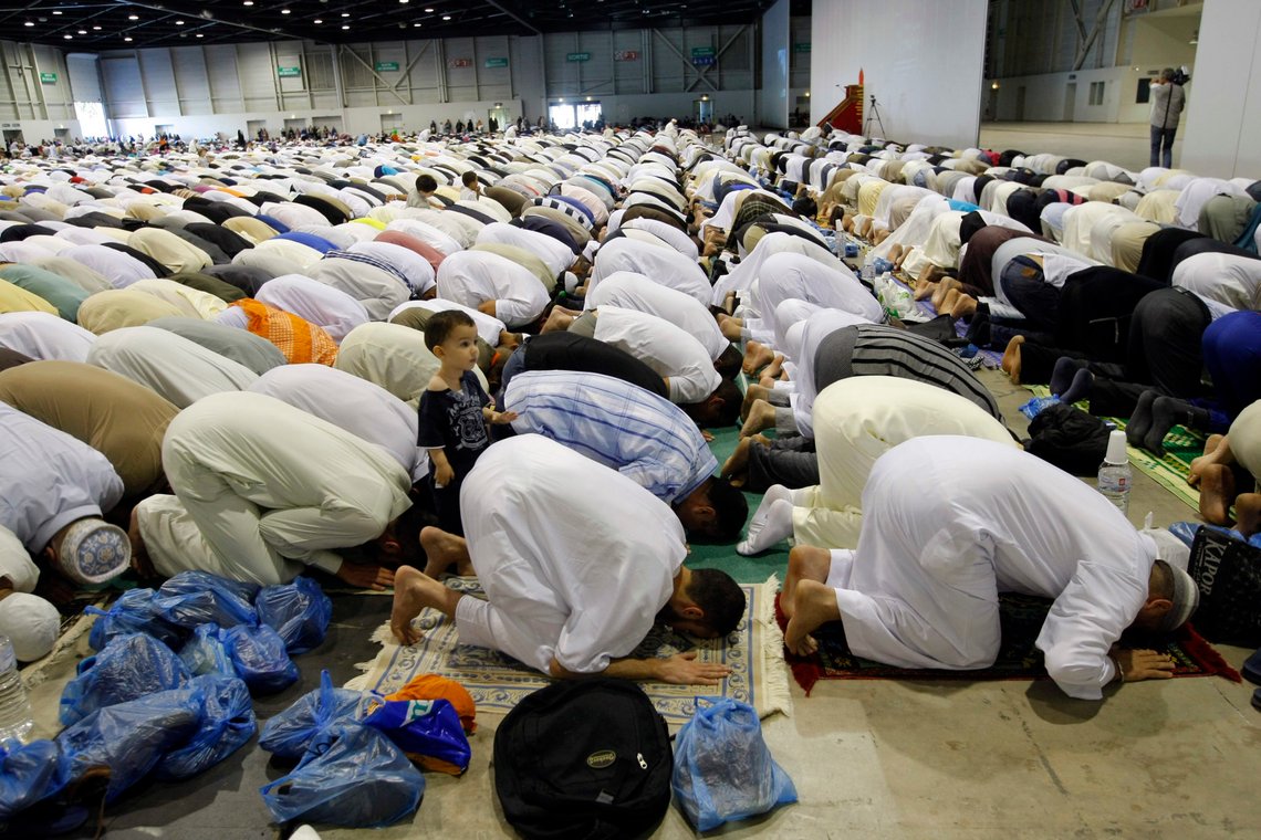 Muslims pray during the Eid al Fitr prayer marking the end of the Islam's holy fasting month of Ramadan at the Exhibition Center of the Parc Chanot , in Marseille, southern France, Monday, July 28, 2014. (AP Photo/Claude Paris) Muslims pray during the Eid al Fitr prayer marking the end of the Islam's holy fasting month of Ramadan at the Exhibition Center of the Parc Chanot , in Marseille, southern France, Monday, July 28, 2014. (AP Photo/Claude Paris)