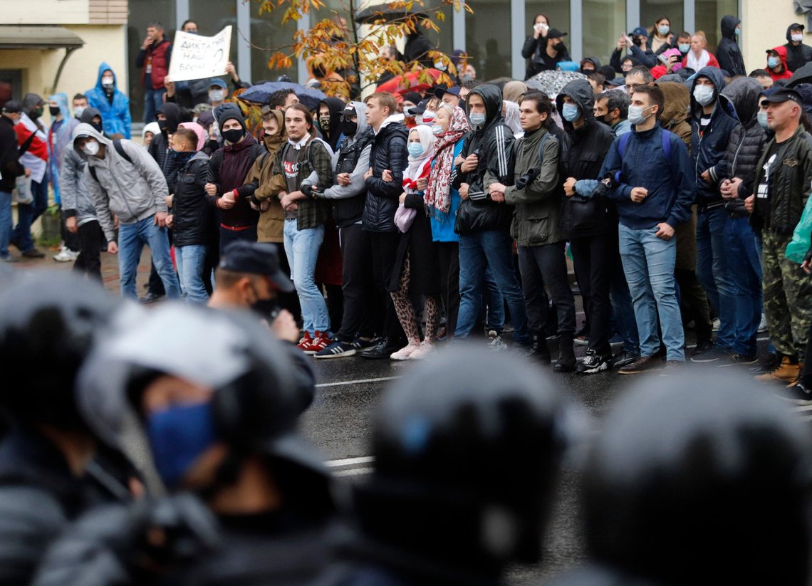 Belarusian opposition supporters block a street during a rally to protest the official presidential election results in Minsk, Belarus, Sunday, Oct. 11, 2020. Belarus' authoritarian president Alexander Lukashenko on Saturday visited a prison to talk to opposition activists, who have been jailed for challenging his re-election that was widely seen as manipulated and triggered two months of protests. (AP Photo) Belarusian opposition supporters block a street during a rally to protest the official presidential election results in Minsk, Belarus, Sunday, Oct. 11, 2020. Belarus' authoritarian president Alexander Lukashenko on Saturday visited a prison to talk to opposition activists, who have been jailed for challenging his re-election that was widely seen as manipulated and triggered two months of protests. (AP Photo)
