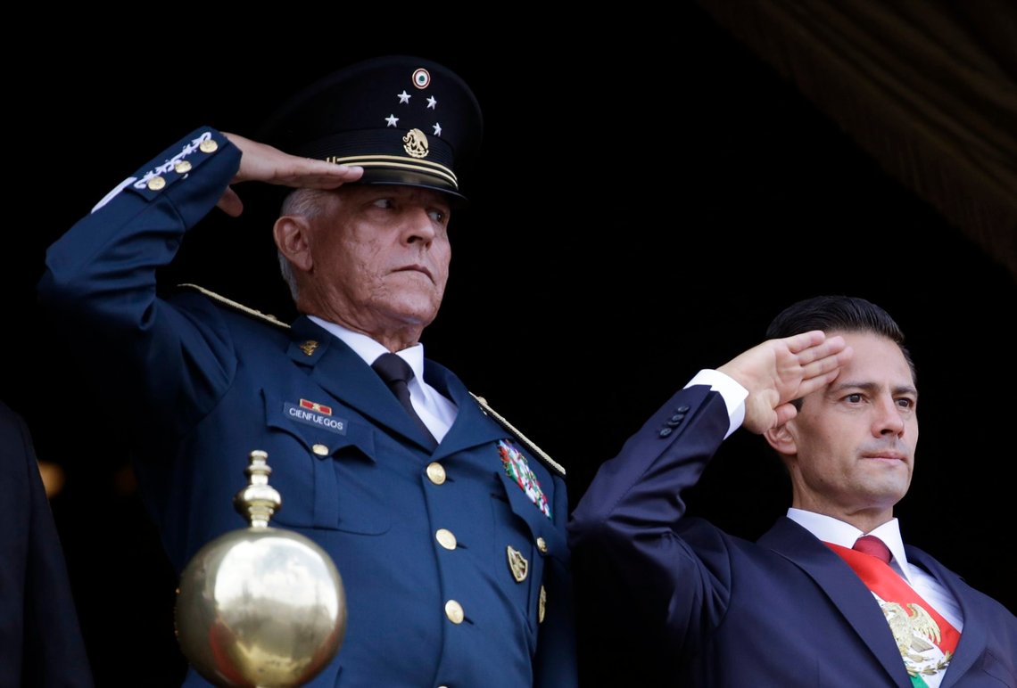 FILE - In this Sept. 16, 2016 file photo, Defense Secretary Gen. Salvador Cienfuegos, left, and Mexico's President Enrique Pena Nieto, salute during the annual Independence Day military parade in Mexico City's main square. Mexico's top diplomat says the country's former defense secretary, Gen. Salvador Cienfuegos, has been arrested in Los Angeles. Foreign Relations Secretary Marcelo Ebrard wrote Thursday, Oct. 15, 2020 in his Twitter account that U.S. Ambassador Christopher Landau had informed him of Cienfuegos' arrest. (AP Photo/Rebecca Blackwell, File) FILE - In this Sept. 16, 2016 file photo, Defense Secretary Gen. Salvador Cienfuegos, left, and Mexico's President Enrique Pena Nieto, salute during the annual Independence Day military parade in Mexico City's main square. Mexico's top diplomat says the country's former defense secretary, Gen. Salvador Cienfuegos, has been arrested in Los Angeles. Foreign Relations Secretary Marcelo Ebrard wrote Thursday, Oct. 15, 2020 in his Twitter account that U.S. Ambassador Christopher Landau had informed him of Cienfuegos' arrest. (AP Photo/Rebecca Blackwell, File)