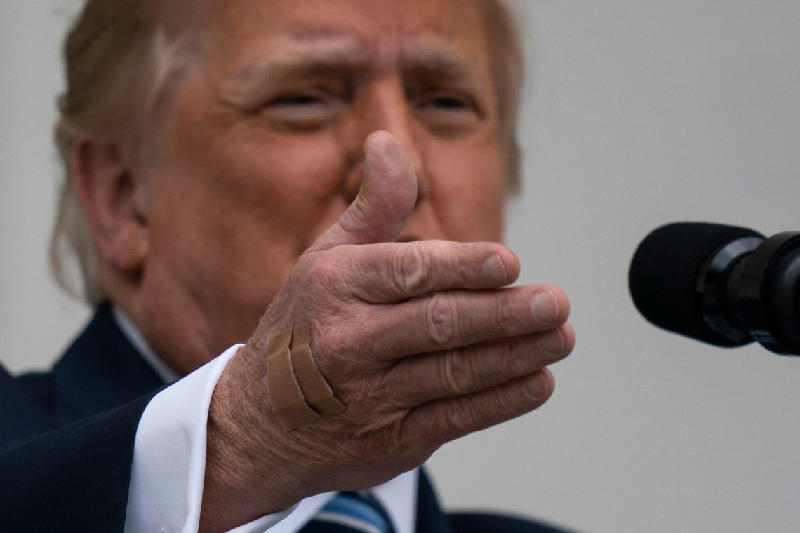 With two bandages on his hand, President Donald Trump gestures while speaking from the Blue Room Balcony of the White House to a crowd of supporters, Saturday, Oct. 10, 2020, in Washington. (AP Photo/Alex Brandon) With two bandages on his hand, President Donald Trump gestures while speaking from the Blue Room Balcony of the White House to a crowd of supporters, Saturday, Oct. 10, 2020, in Washington. (AP Photo/Alex Brandon)