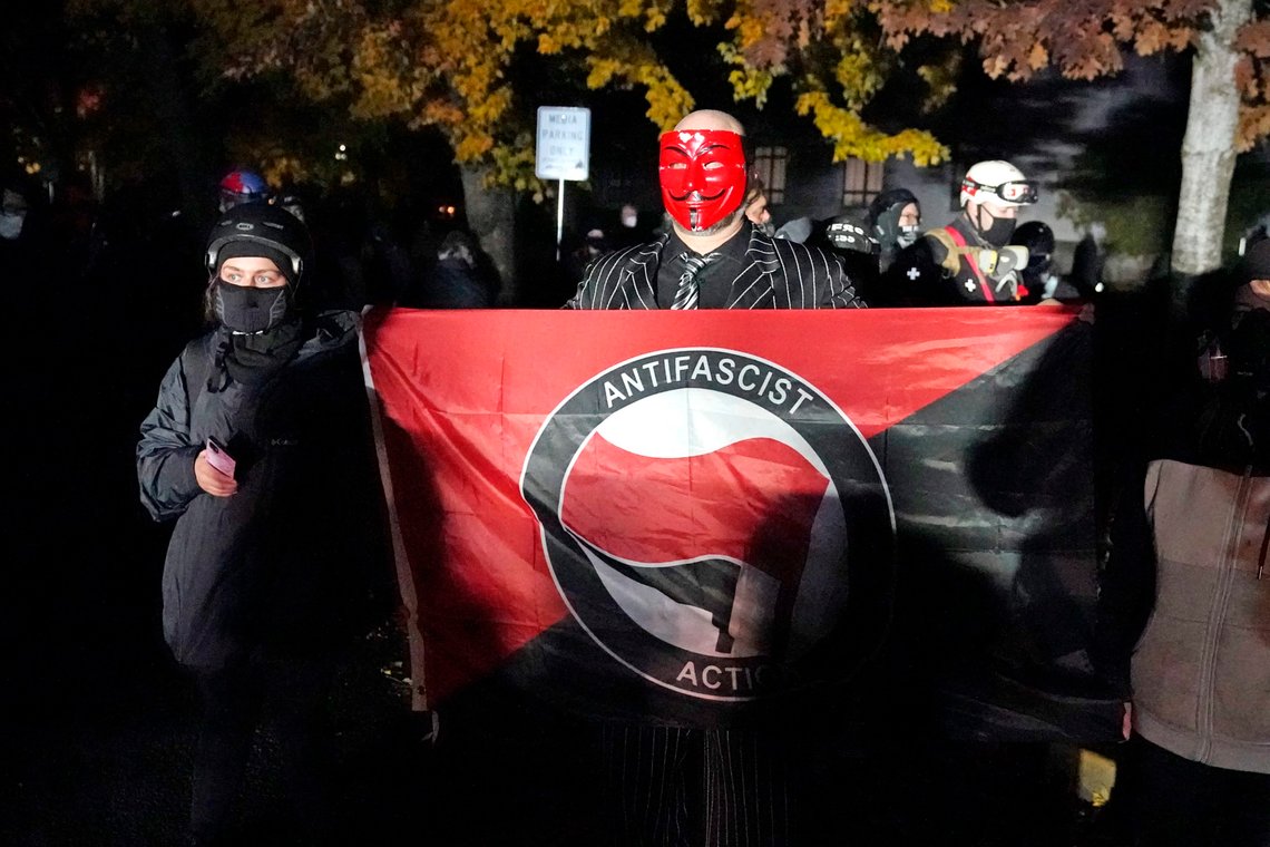 Protesters stand outside the Oregon State Capitol building Saturday, Nov 7, 2020, in Salem, Ore. Democrat Joe Biden defeated President Trump to become the 46th president of the United States on Saturday. (AP Photo/Marcio Jose Sanchez) Protesters stand outside the Oregon State Capitol building Saturday, Nov 7, 2020, in Salem, Ore. Democrat Joe Biden defeated President Trump to become the 46th president of the United States on Saturday. (AP Photo/Marcio Jose Sanchez)
