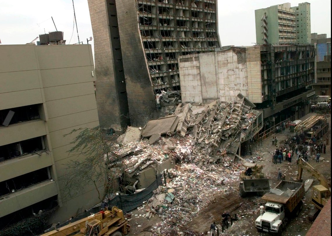 FILE - In this Aug. 8, 1998 file photo, the United States Embassy, left, and other damaged buildings in downtown Nairobi, Kenya, are shown on the day after it was bombed by terrorists. Some of the victims of the bombing will be in Washington on Monday, Feb . 24, 2020, to hear arguments in a Supreme Court case that could affect the compensation they ultimately receive for their injuries. (AP Photo/Dave Caulkin, File) FILE - In this Aug. 8, 1998 file photo, the United States Embassy, left, and other damaged buildings in downtown Nairobi, Kenya, are shown on the day after it was bombed by terrorists. Some of the victims of the bombing will be in Washington on Monday, Feb . 24, 2020, to hear arguments in a Supreme Court case that could affect the compensation they ultimately receive for their injuries. (AP Photo/Dave Caulkin, File)