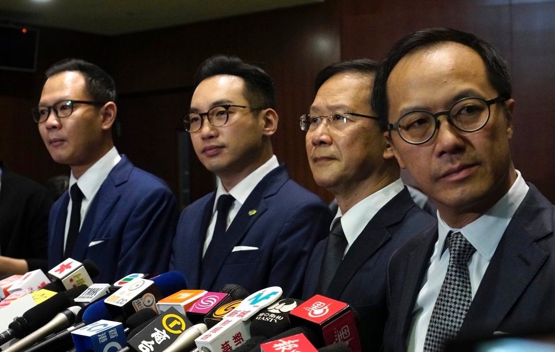 Four lawmakers, from left, Dennis Kwok, Alvin Yeung, Kwok Ka-ki and Kenneth Leung listen to reporters questions during a press conference at Legislative Council in Hong Kong, Wednesday, Nov. 11, 2020. Hong Kong has moved to disqualify the four pro-democracy legislators after Beijing passed a resolution that would allow the local government to remove lawmakers from their positions if they're deemed to threaten national security. (AP Photo/Vincent Yu) Four lawmakers, from left, Dennis Kwok, Alvin Yeung, Kwok Ka-ki and Kenneth Leung listen to reporters questions during a press conference at Legislative Council in Hong Kong, Wednesday, Nov. 11, 2020. Hong Kong has moved to disqualify the four pro-democracy legislators after Beijing passed a resolution that would allow the local government to remove lawmakers from their positions if they're deemed to threaten national security. (AP Photo/Vincent Yu)