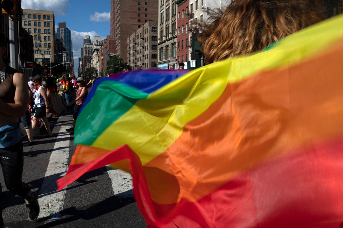 FILE - In this June 30, 2019, file photo parade-goers carrying rainbow flags walk down a street during the LBGTQ Pride march in New York, to celebrate five decades of LGBTQ pride, marking the 50th anniversary of the police raid that sparked the modern-day gay rights movement. Democrats flooded Twitter and email inboxes this week with praise for the watershed Supreme Court decision shielding gay, lesbian and transgender people from job discrimination. (AP Photo/Wong Maye-E, File) FILE - In this June 30, 2019, file photo parade-goers carrying rainbow flags walk down a street during the LBGTQ Pride march in New York, to celebrate five decades of LGBTQ pride, marking the 50th anniversary of the police raid that sparked the modern-day gay rights movement. Democrats flooded Twitter and email inboxes this week with praise for the watershed Supreme Court decision shielding gay, lesbian and transgender people from job discrimination. (AP Photo/Wong Maye-E, File)