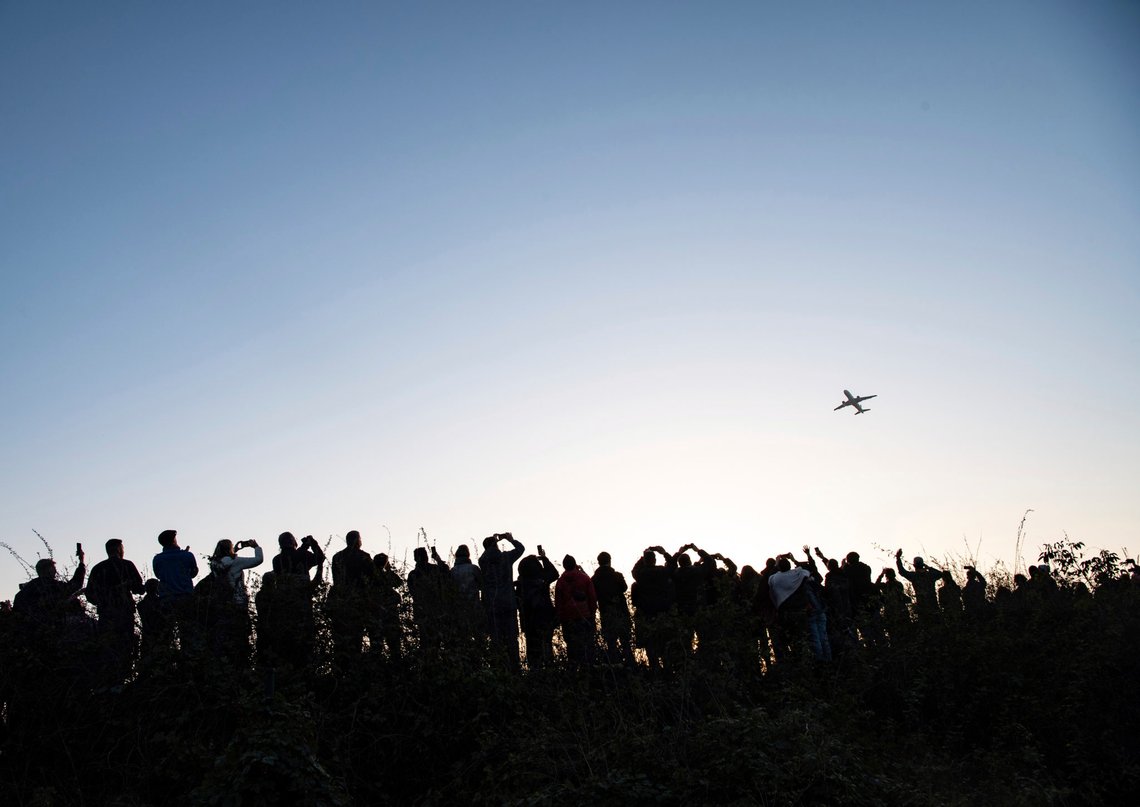Hundreds of people watch and photograph the Airbus of the French airline Air France taking off from Tegel (TXL) airport in Berlin, Germany, Sunday, Nov. 8, 2020. Tegel Airport closes with the departure of the last scheduled flight number AF 1235 to Paris. (Paul Zinken/dpa via AP) Hundreds of people watch and photograph the Airbus of the French airline Air France taking off from Tegel (TXL) airport in Berlin, Germany, Sunday, Nov. 8, 2020. Tegel Airport closes with the departure of the last scheduled flight number AF 1235 to Paris. (Paul Zinken/dpa via AP)