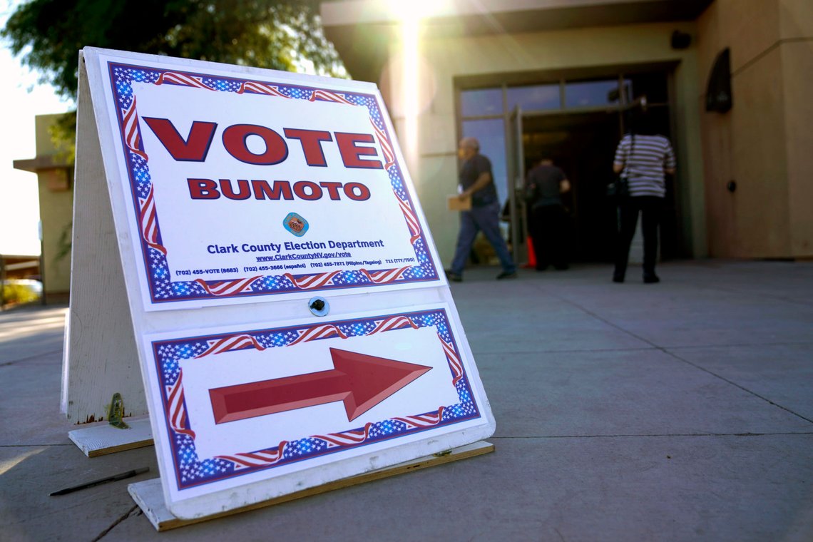 FILE - In this Oct. 30, 2020 file photo people wait in line to vote at a polling place on the final day of early voting in Las Vegas. More than 1.1 million Nevadans have already cast ballots ahead of Tuesday's election, where the state will be a presidential battleground, two incumbent Democratic members of Congress will try to hold on to their seats and voters will settle dozens of races for statewide, legislative and judicial offices and five statewide ballot questions. (AP Photo/John Locher,File) FILE - In this Oct. 30, 2020 file photo people wait in line to vote at a polling place on the final day of early voting in Las Vegas. More than 1.1 million Nevadans have already cast ballots ahead of Tuesday's election, where the state will be a presidential battleground, two incumbent Democratic members of Congress will try to hold on to their seats and voters will settle dozens of races for statewide, legislative and judicial offices and five statewide ballot questions. (AP Photo/John Locher,File)