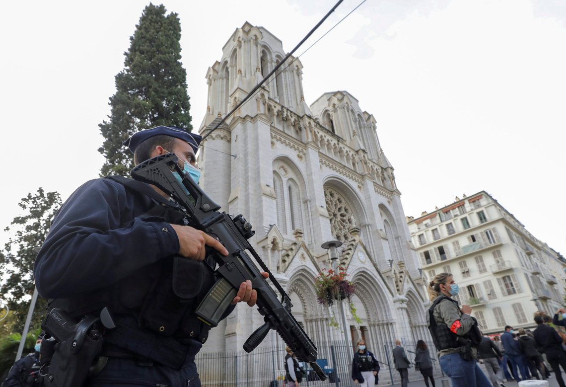 A French police officers stands near Notre Dame church in Nice, southern France, Thursday, Oct. 29, 2020. French President Emmanuel Macron has announced that he will more than double number of soldiers deployed to protect against attacks to 7,000 after three people were killed at a church Thursday. (Eric Gaillard/Pool via AP) A French police officers stands near Notre Dame church in Nice, southern France, Thursday, Oct. 29, 2020. French President Emmanuel Macron has announced that he will more than double number of soldiers deployed to protect against attacks to 7,000 after three people were killed at a church Thursday. (Eric Gaillard/Pool via AP)