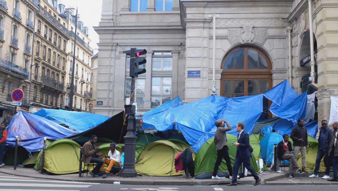 Refugees from Sudan set up camp in front of the town hall of the 18th district, in Paris, France, Tuesday Sept. 15, 2015. The U.N. refugee agency says more than 300,000 migrants have sought to cross the Mediterranean Sea this year, nearly 40 percent more than the record number in all of last year. (AP Photo/Jacques Brinon) Refugees from Sudan set up camp in front of the town hall of the 18th district, in Paris, France, Tuesday Sept. 15, 2015. The U.N. refugee agency says more than 300,000 migrants have sought to cross the Mediterranean Sea this year, nearly 40 percent more than the record number in all of last year. (AP Photo/Jacques Brinon)