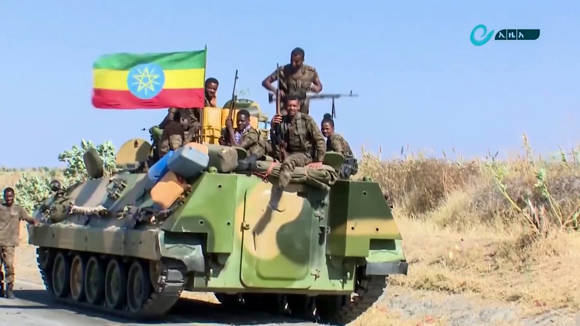 This image made from undated video released by the state-owned Ethiopian News Agency on Monday, Nov. 16, 2020 shows Ethiopian military sitting on an armored personnel carrier next to a national flag, on a road in an area near the border of the Tigray and Amhara regions of Ethiopia. Ethiopia's prime minister Abiy Ahmed said in a social media post on Tuesday, Nov. 17, 2020 that "the final and crucial" military operation will launch in the coming days against the government of the country's rebellious northern Tigray region. (Ethiopian News Agency via AP) This image made from undated video released by the state-owned Ethiopian News Agency on Monday, Nov. 16, 2020 shows Ethiopian military sitting on an armored personnel carrier next to a national flag, on a road in an area near the border of the Tigray and Amhara regions of Ethiopia. Ethiopia's prime minister Abiy Ahmed said in a social media post on Tuesday, Nov. 17, 2020 that "the final and crucial" military operation will launch in the coming days against the government of the country's rebellious northern Tigray region. (Ethiopian News Agency via AP)