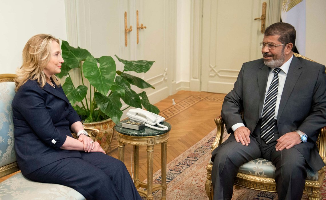 U.S. Secretary of State Hillary Rodham Clinton, left, meets with Egyptian President Mohammed Morsi, right, at the presidential palace in Cairo on July 14, 2012. Clinton hoped to use her first meeting with Egypt's new Islamist president on Saturday to steer Mohammed Morsi toward opening a dialogue with the military that could end the country's political crisis. (AP Photo/Brendan Smialowski, Pool) U.S. Secretary of State Hillary Rodham Clinton, left, meets with Egyptian President Mohammed Morsi, right, at the presidential palace in Cairo on July 14, 2012. Clinton hoped to use her first meeting with Egypt's new Islamist president on Saturday to steer Mohammed Morsi toward opening a dialogue with the military that could end the country's political crisis. (AP Photo/Brendan Smialowski, Pool)
