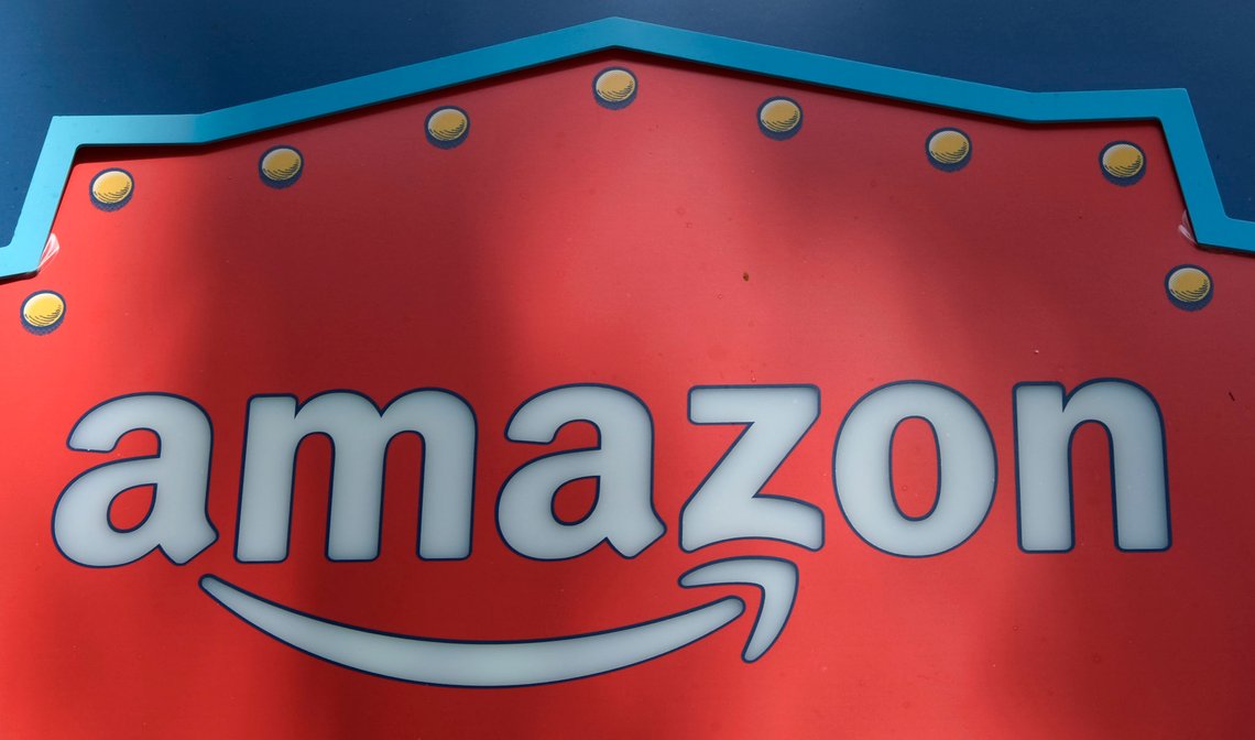 FILE - In this Oct. 23, 2018, file photo, an Amazon logo is seen atop the Amazon Treasure Truck The Park DTLA office complex in downtown Los Angeles. Five technology giants reported mixed earnings results Thursday, Oct. 29, 2020 a sign of varying fortunes as they try to rebound from an pandemic-related economic slowdown earlier this year. While all five Amazon, Google parent Alphabet, Facebook, Apple and Twitter exceeded analyst expectations, gloomy forecasts and other uncertainties led to share-price declines for all but Alphabet in after-market trading. (AP Photo/Richard Vogel, File) FILE - In this Oct. 23, 2018, file photo, an Amazon logo is seen atop the Amazon Treasure Truck The Park DTLA office complex in downtown Los Angeles. Five technology giants reported mixed earnings results Thursday, Oct. 29, 2020 a sign of varying fortunes as they try to rebound from an pandemic-related economic slowdown earlier this year. While all five Amazon, Google parent Alphabet, Facebook, Apple and Twitter exceeded analyst expectations, gloomy forecasts and other uncertainties led to share-price declines for all but Alphabet in after-market trading. (AP Photo/Richard Vogel, File)