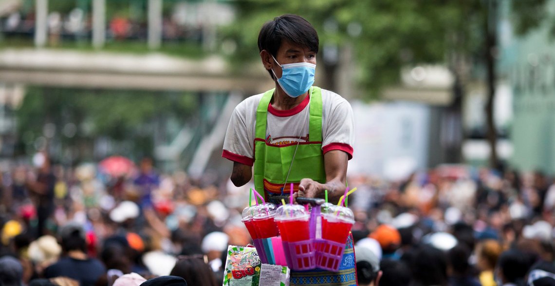 A vendor sells drinks at an anti-government rally at a major intersection in Bangkok, Thailand, Wednesday, Nov. 18, 2020. Police in Thailand's capital braced for possible trouble Wednesday, a day after a protest outside Parliament by pro-democracy demonstrators was marred by violence that left dozens of people injured. (AP Photo/Wason Wanichakorn) A vendor sells drinks at an anti-government rally at a major intersection in Bangkok, Thailand, Wednesday, Nov. 18, 2020. Police in Thailand's capital braced for possible trouble Wednesday, a day after a protest outside Parliament by pro-democracy demonstrators was marred by violence that left dozens of people injured. (AP Photo/Wason Wanichakorn)