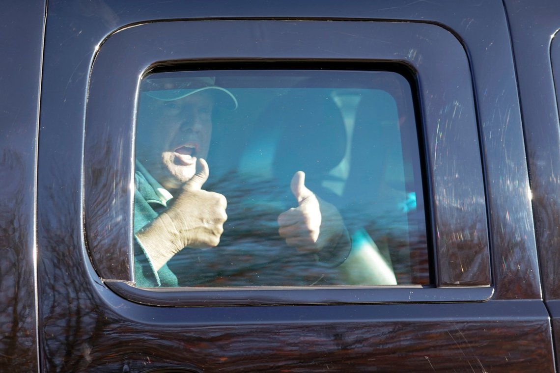 President Donald Trump gives two thumbs up to supporters as he departs after playing golf at the Trump National Golf Club in Sterling Va., Sunday Nov. 8, 2020. (AP Photo/Steve Helber) President Donald Trump gives two thumbs up to supporters as he departs after playing golf at the Trump National Golf Club in Sterling Va., Sunday Nov. 8, 2020. (AP Photo/Steve Helber)