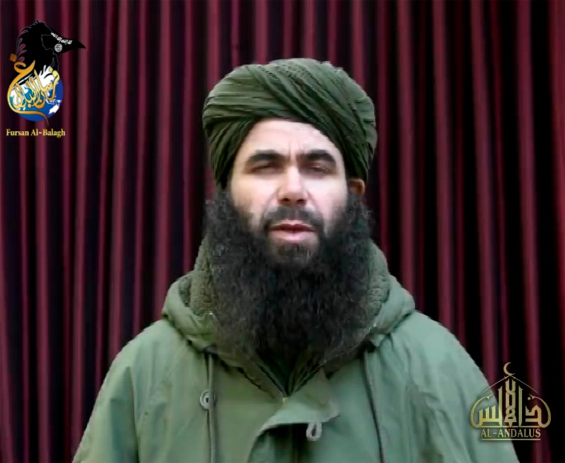 In this photo taken from video is Abdelmalek Droukdel. The French military and allied forces in Mali killed the longtime leader of al-Qaida's North African arm, who commanded jihadists in his native Algeria and then spread their movement across Africa's Sahel region, France's defense minister said Friday, June 5, 2020. Abdelmalek Droukdel, known as the emir of al-Qaida in the Islamic Maghreb, was killed in an operation Wednesday, June 3, in northern Mali along with several people in his entourage, Defense Minister Florence Parly tweeted. (Militant video via AP) In this photo taken from video is Abdelmalek Droukdel. The French military and allied forces in Mali killed the longtime leader of al-Qaida's North African arm, who commanded jihadists in his native Algeria and then spread their movement across Africa's Sahel region, France's defense minister said Friday, June 5, 2020. Abdelmalek Droukdel, known as the emir of al-Qaida in the Islamic Maghreb, was killed in an operation Wednesday, June 3, in northern Mali along with several people in his entourage, Defense Minister Florence Parly tweeted. (Militant video via AP)