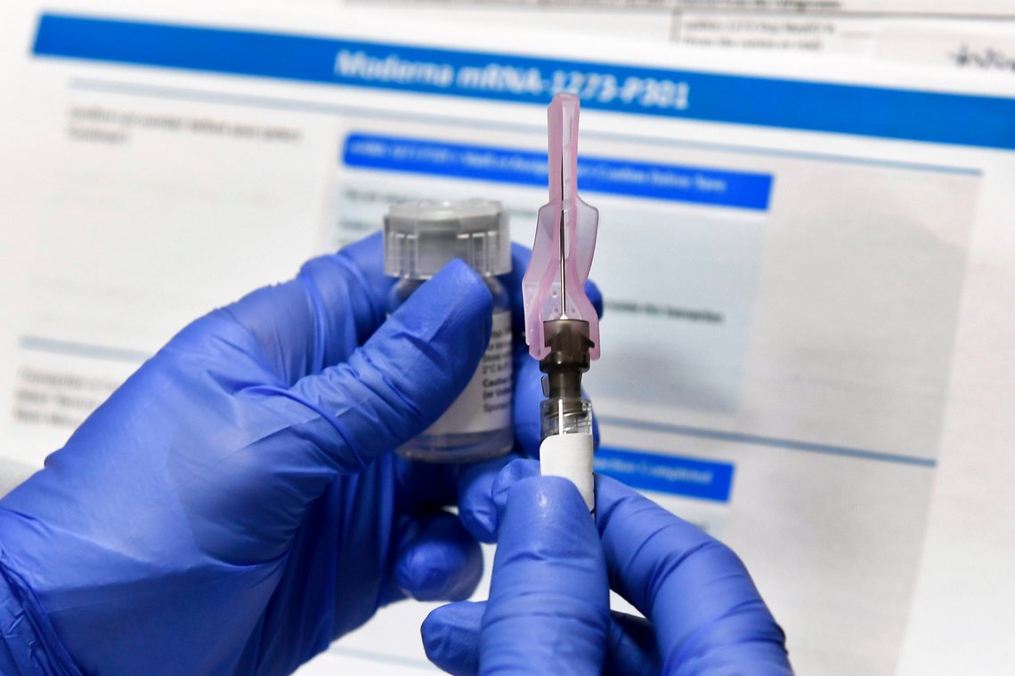 FILE - In this Monday, July 27, 2020 file photo, a nurse prepares a shot as a study of a possible COVID-19 vaccine, developed by the National Institutes of Health and Moderna Inc., gets underway in Binghamton, N.Y. Microsoft says state-backed Russian and North Korean hackers have in recent months tried to steal valuable data from leading pharmaceutical companies and COVID-19 vaccine researchers. (AP Photo/Hans Pennink) FILE - In this Monday, July 27, 2020 file photo, a nurse prepares a shot as a study of a possible COVID-19 vaccine, developed by the National Institutes of Health and Moderna Inc., gets underway in Binghamton, N.Y. Microsoft says state-backed Russian and North Korean hackers have in recent months tried to steal valuable data from leading pharmaceutical companies and COVID-19 vaccine researchers. (AP Photo/Hans Pennink)