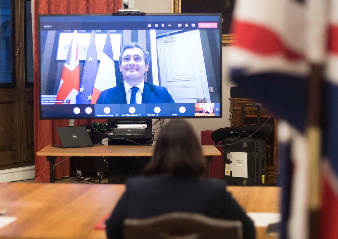 Britain's Home Secretary Priti Patel, front, at the Home Office in central London, where she signed a new agreement with her French counterpart Gerald Darmanin, seen on screen, aimed at curbing the number of migrants crossing the English Channel in small boats, Saturday Nov. 28, 2020. The lawmakers met via a video Internet link, agreeing to double the number of French police patrolling a 150km stretch of coastline in northern France in an attempt to stop people crossing the English Channel in small boats. (Stefan Rousseau/PA via AP) Britain's Home Secretary Priti Patel, front, at the Home Office in central London, where she signed a new agreement with her French counterpart Gerald Darmanin, seen on screen, aimed at curbing the number of migrants crossing the English Channel in small boats, Saturday Nov. 28, 2020. The lawmakers met via a video Internet link, agreeing to double the number of French police patrolling a 150km stretch of coastline in northern France in an attempt to stop people crossing the English Channel in small boats. (Stefan Rousseau/PA via AP)