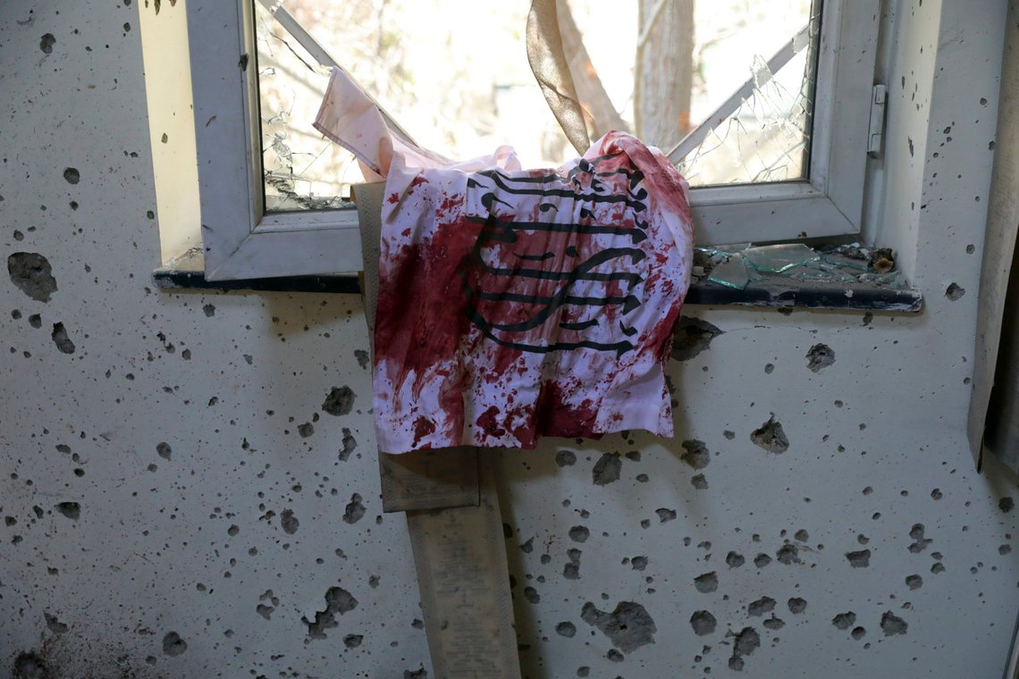 A blood-stained Taliban flag is seen on the window inside the Kabul University after a deadly attack in Kabul, Afghanistan, Tuesday, Nov. 3, 2020. The brazen attack by gunmen who stormed the university has left many dead and wounded in the Afghan capital. The assault sparked an hours-long gun battle. (AP Photo/Rahmat Gul) A blood-stained Taliban flag is seen on the window inside the Kabul University after a deadly attack in Kabul, Afghanistan, Tuesday, Nov. 3, 2020. The brazen attack by gunmen who stormed the university has left many dead and wounded in the Afghan capital. The assault sparked an hours-long gun battle. (AP Photo/Rahmat Gul)