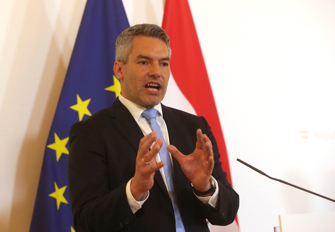 Austrian Interior Minister Karl Nehammer speaks during a press conference at the federal chancellery in Vienna, Austria, Wednesday, July 1, 2020. The Austrian government has moved to restrict freedom of movement for people, in an effort to slow the onset of the COVID-19 coronavirus. (AP Photo/Ronald Zak) Austrian Interior Minister Karl Nehammer speaks during a press conference at the federal chancellery in Vienna, Austria, Wednesday, July 1, 2020. The Austrian government has moved to restrict freedom of movement for people, in an effort to slow the onset of the COVID-19 coronavirus. (AP Photo/Ronald Zak)